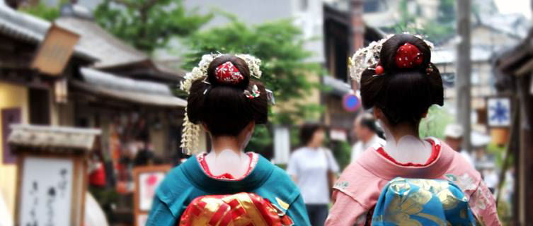 Geishas walking down a Kyoto street