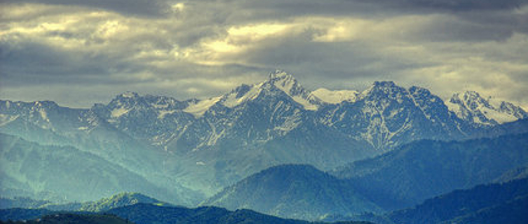 Almaty is framed by the snow-capped peaks of the Zailysky-Alatau mountains,