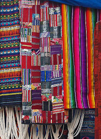 See colourful textiles at Chichicastenango's market