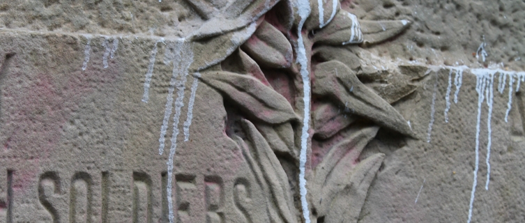 Paint drips down the cemetery's main monument