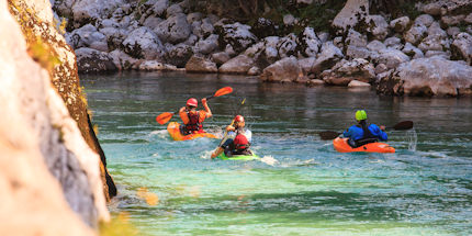 Kayaking the Soca River is just one way to get adventurous in Slovenia