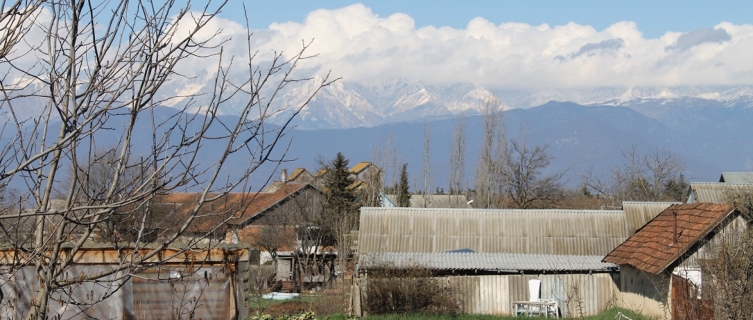 The village is overlooked by the Caucasus Mountains