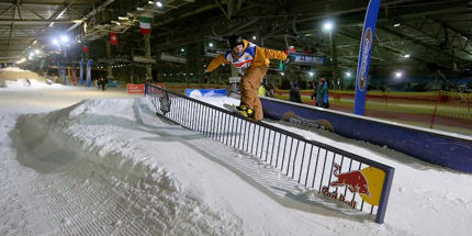 A boarder rides the rail at SnowWorld